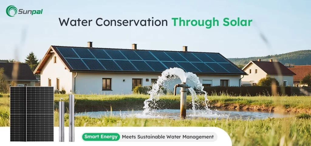 Solar panels installed on a rural home with a water fountain spraying in the foreground under a clear sky.