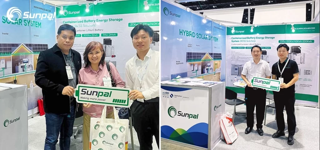 Two groups of people posing with Sunpal signs at the solar energy exhibit booth.