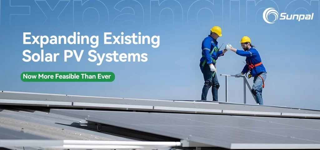 Technicians adjusting solar panels on a sunny rooftop during system expansion.