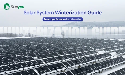 Solar farm with panels covered by snow, illustrating winter-ready PV systems.