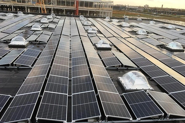 50KW rooftop solar system in Ecuador showing ballast mount structure and PV panel installation