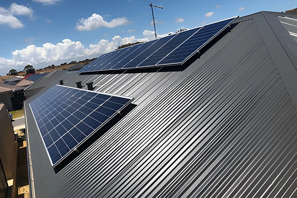 Side view of 10KW metal roof solar project in Costa Rica showing panel tilt and mounting structure