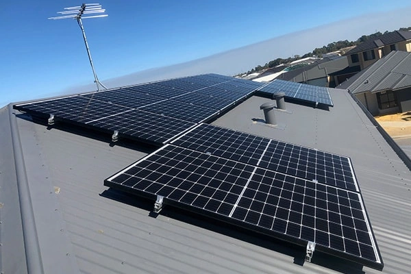 Angled view of 10KW metal roof solar project in Costa Rica showing overall layout and mounting details