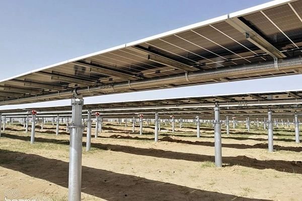 Side view of 100KW solar system in Zhejiang, China showing panel tilt and single-axis tracking structure